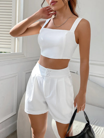 A casual suit for women with a one-neck halter top and white shorts
